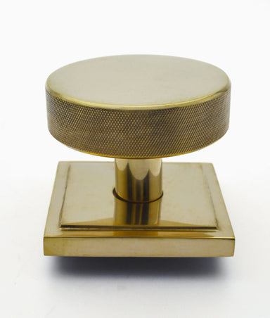 Unlacquered Polished Brass Knurled Centre Door Knob on Square Base